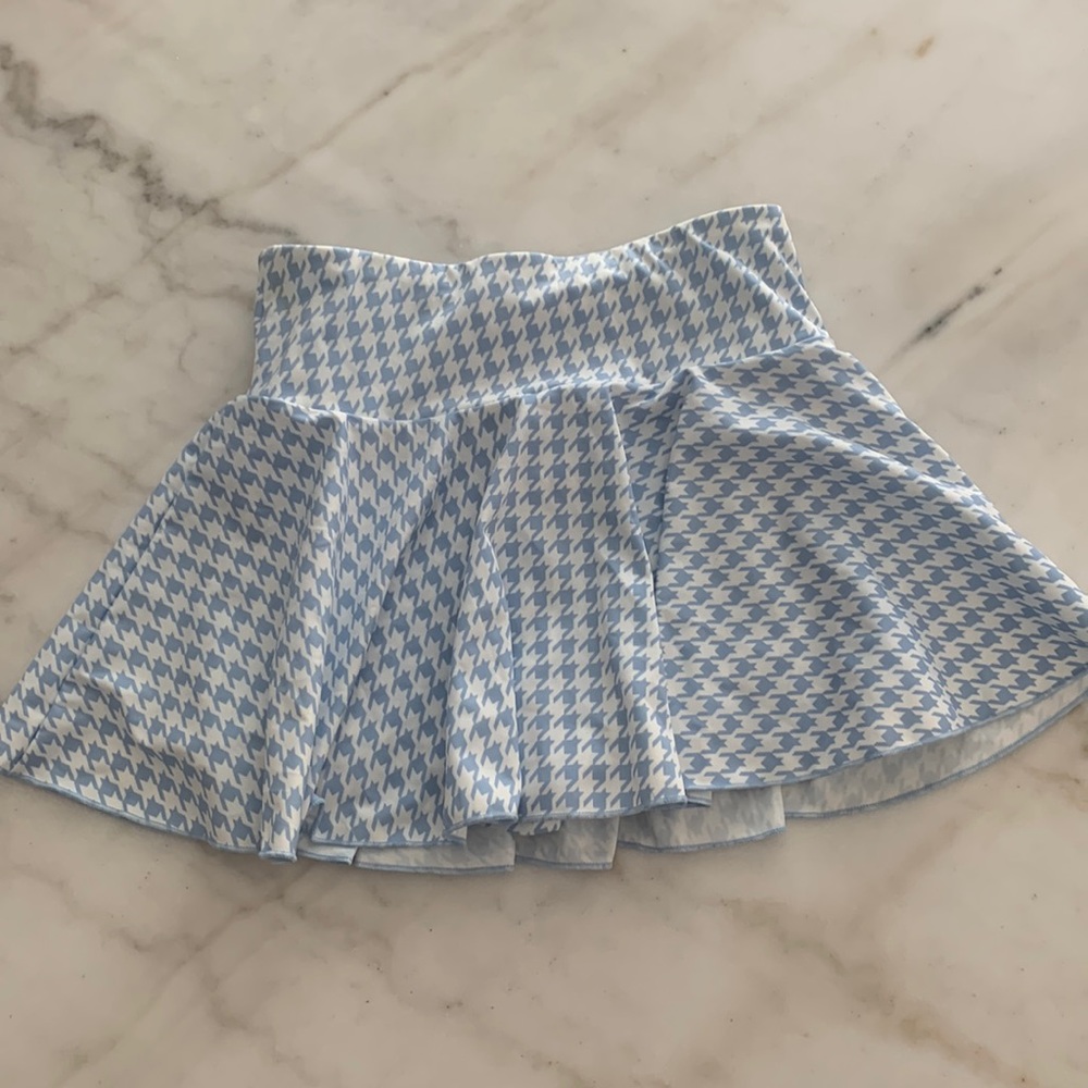 Plaid baby blue and white skirt. For playing tennis or just to look cute